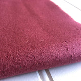 close-up of mauve raspberry raw silk noil texture